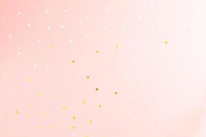 Pink backdrop with glitter and golden stars confetti. Festive holiday bright background photo