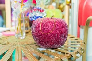 Red artificial handmade apple - christmas bauble for decoration. photo