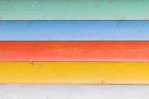 Multicolored wooden background texture. Close up of colorful fence photo