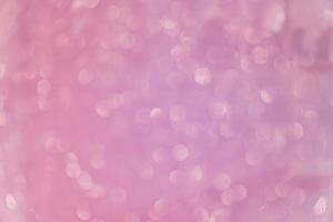 Bokeh abstract texture. Beautiful christmas background in purple colors. Defocused photo