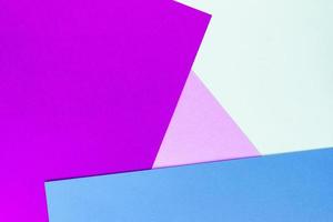 Abstract geometric paper background of purple, blue and beige colors photo