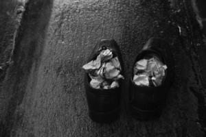 A pair of wet shoes in a rainy day photo