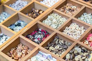 Assortment of colorful ceramic buttons and beads for making handmade accesories. photo