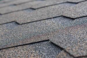 Roobing shingles background. Selective focus photo