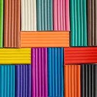 Rainbow colors of modeling clay. Multicolored plasticine bars background. photo