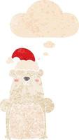 cartoon bear wearing christmas hat and thought bubble in retro textured style vector