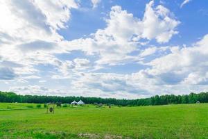 rural landscape in summer sunny day. Green forest and beautiful sky with clouds. photo