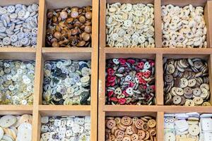 Assortment of colorful ceramic buttons and beads for making handmade accesories. photo