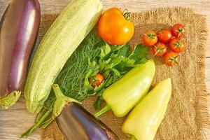 top view of organic vegetables on wooden table. Healthy food background, with copy space photo