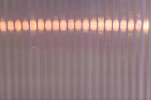 Defocused Polycarbonate plastic sheet, abstract background texture photo