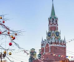 Spasskaya tower of Kremlin and festive decorations on Red Square in Moscow photo