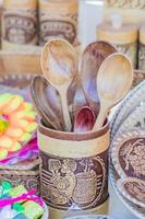 new wooden spoons in wooden jar bade of birch bark, sunday street market photo