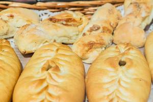 Close up of russian meet pies baked in oven. photo