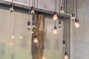 loft interior details. hanging lamps with lights on photo