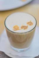 close up of vanilla raf coffee in transparent glass. Tasty hot drink. Soft focus photo