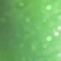 Bokeh abstract texture. Beautiful christmas background in green colors. Defocused photo