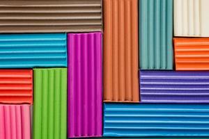 Rainbow colors of modeling clay. Multicolored plasticine bars background. photo