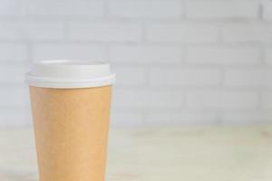 craft paper coffee cup. Coff to go on gray background photo