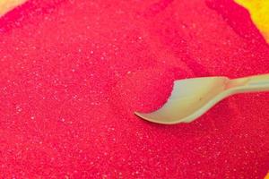 colored sand in plastic bowls. Workshop for making sand pictures for kids photo