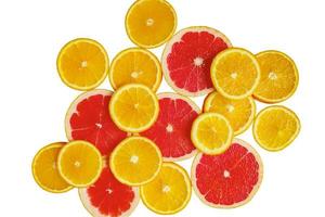 citrus slice, oranges and grapefruits on white background. Fruits backdrop photo