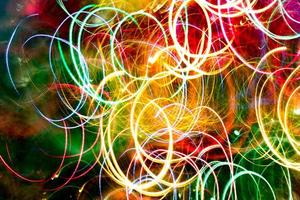 Abstract burred texture background of colorful bokeh motion. Long exposure of small neon lights photo