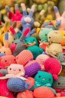 colorful handmade knitted small toys for children, background photo
