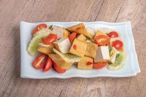 Fried tofu salad with fresh vegetables. Weight loss diet. photo