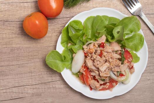 Spicy Tuna Salad in white plate photo