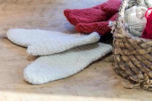 knitted white and red mittens on a table, knit workshop details photo