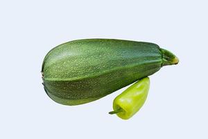 new vegetables harvest - ripe zucchini and bell pepper isolated on white baclground photo