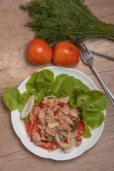 Spicy Tuna Salad in white plate photo
