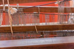 close up of arabic loom for weaving carpet in the room photo