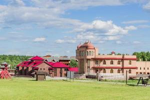 Russia, Kaluga region, 2018 - Ethnomir Park. ethnographic and amusement park-museum. walkpath along ethnic hotels photo