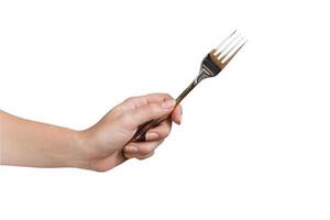 mujer mano sujetando tenedor aislado sobre fondo blanco. gesto de comer. foto