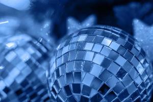 Trend color 2020 classic blue, top view, disco ball background for design. photo