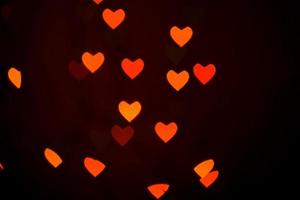 Heart bokeh background, Love and Valentine day concept. Red Shiny hearts light photo