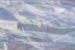 The texture of the transparent polyethylene package. a surface covered with multiple layers of cellophane. photo