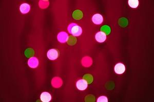 abstract blurred lights on background in pink and  green - christmas celebration concept photo