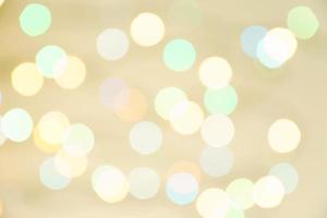 luces borrosas abstractas en el fondo en colores pastel. -concepto de celebración de navidad foto