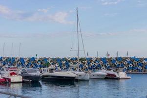 Sochi, Russia, 2019 - group of yachts are parked in the harbor in a summer day photo