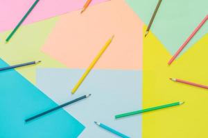 Abstract different multicolored trendy neon backgrounds with pencils and place for text. Top view. photo