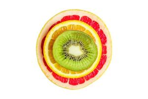 citrus slice, kiwi, oranges and grapefruits on white background. Fruits backdrop photo