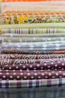 Assortment of natural fabrics and textiles. DIY materiials for craft and scrapbooking. Sewing industry concept photo