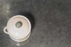 ceramic bowl on black table top.  top view, copy space photo