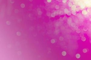 Bokeh abstract texture. Beautiful christmas background in pink colors. Defocused photo