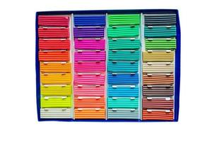 Modeling clay. Multicolored plasticine bars in a box isolated on white background. photo