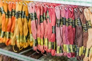 Moscow, Russia, 2019 - Stend of Embroidery Floss in a shop. Colorfull textrure background photo