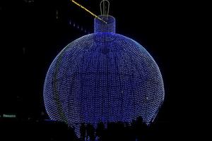 Moscow, Russia, 2018 - Giant New Year Tree LED Light Ball on Poklonnaya Hill at night photo