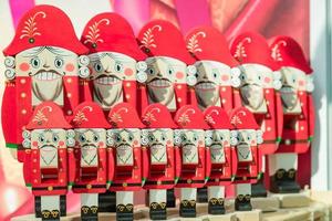 Set of chritmas wooden nutcrackers on the shelf. traditional Christmas market in Moscow, Russia photo