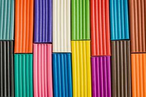 Rainbow colors of modeling clay. Multicolored plasticine bars  background. photo